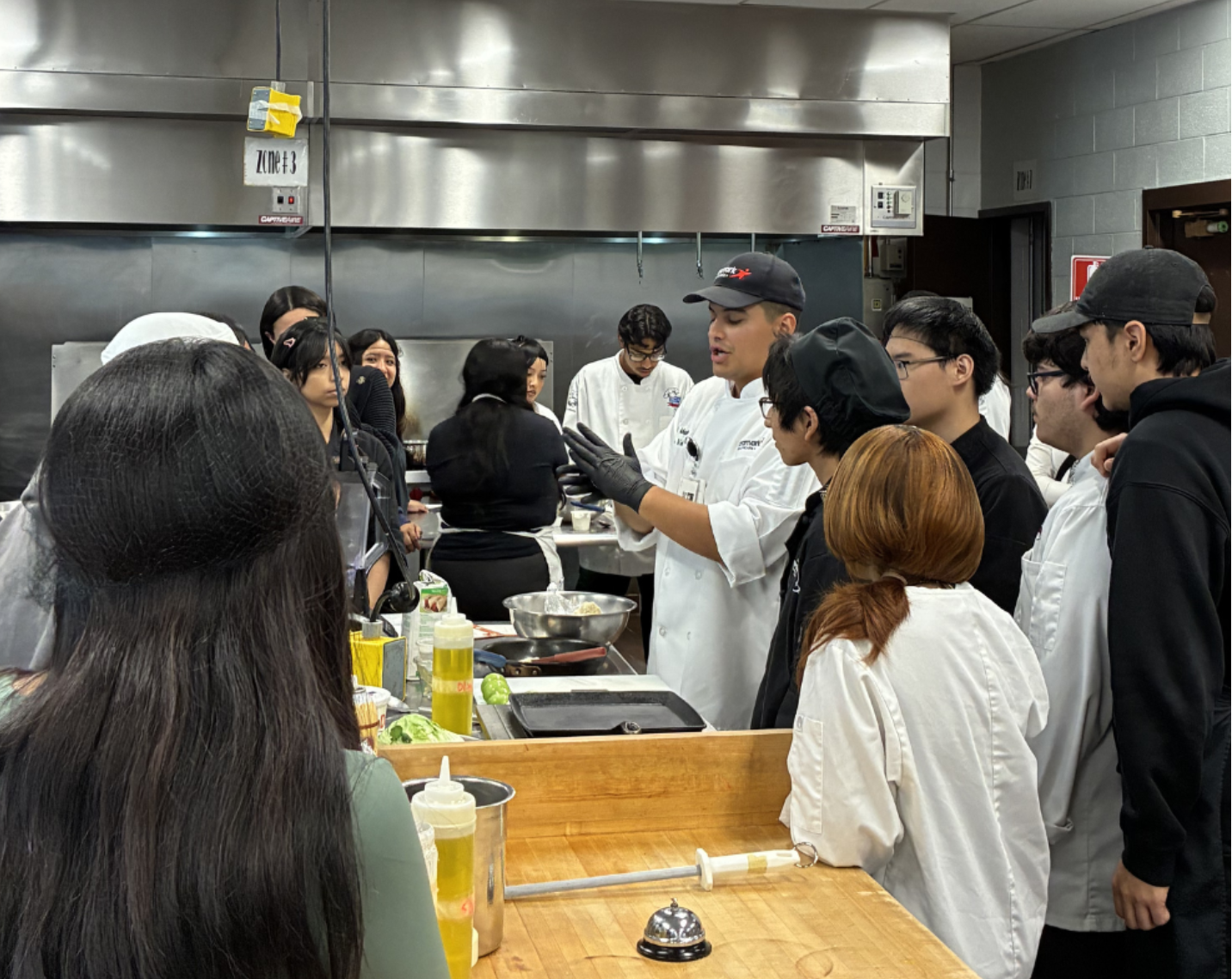 Chef Luis Velasco teaching students how to make traditional sopes. 